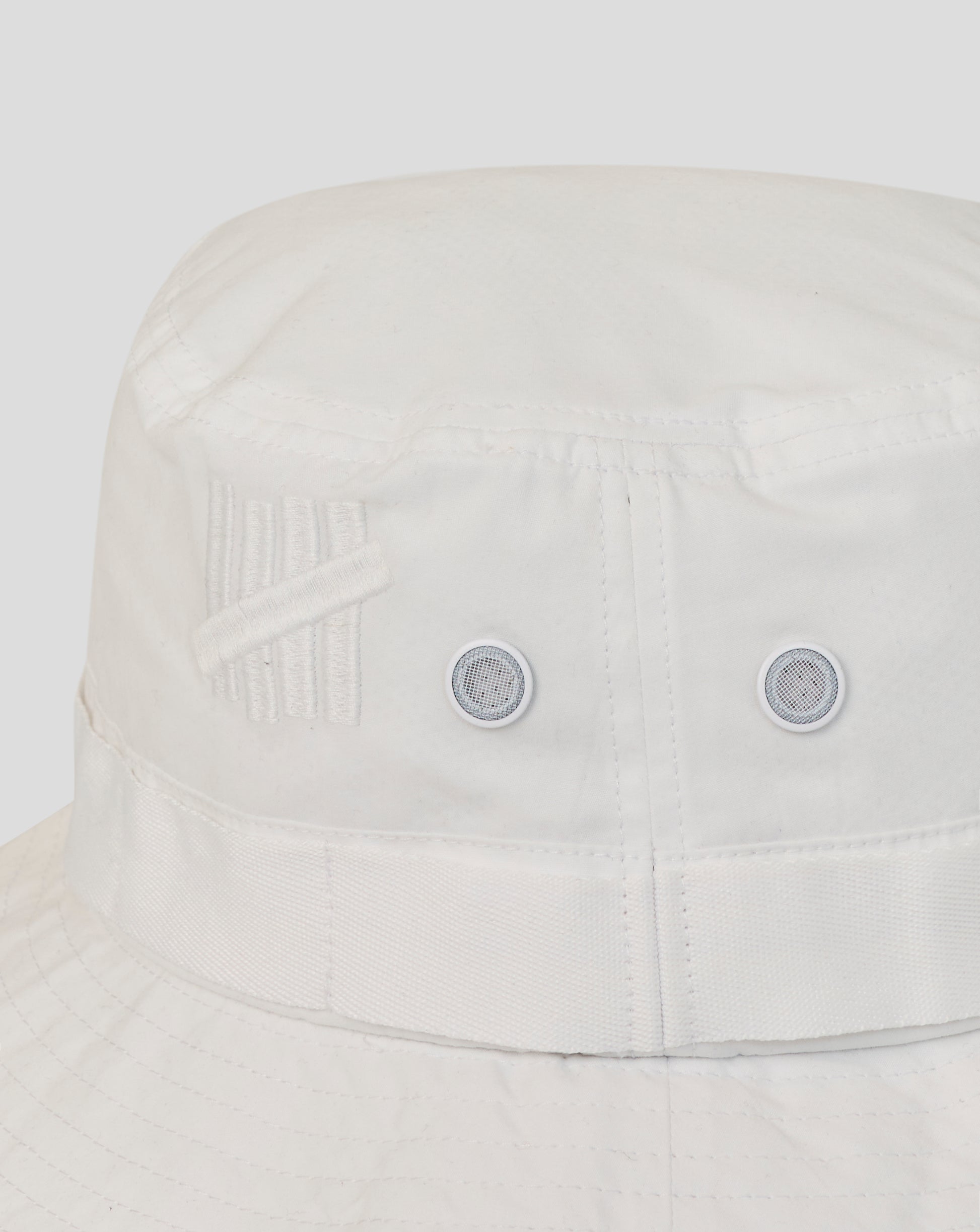 Light gray bucket hat with a subtle pattern on a light gray background