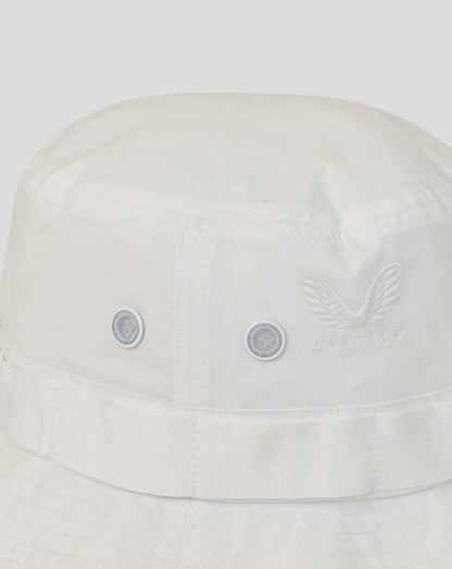 White bucket hat with brand logo on a light gray background