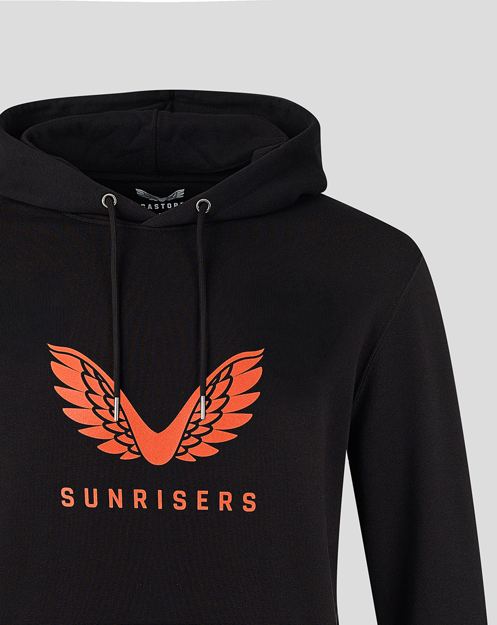 Close up of black hoodie chest displaying orange SUNRISERS wings logo.