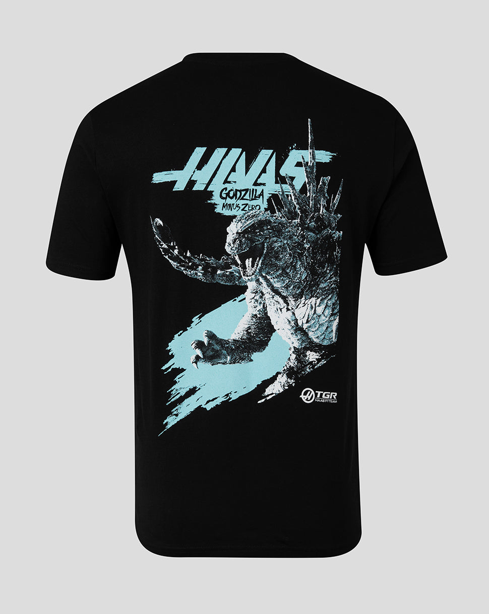 A black short-sleeve t-shirt shown from the back, featuring a large graphic print of Godzilla with the text 'HAAS GODZILLA' and a light blue paint-splatter design on a light gray background.