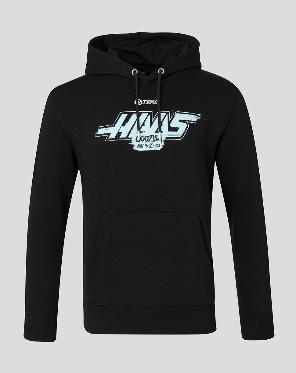 A black pullover hoodie with a white and gray graphic print on the chest reading 'Haas Godzilla' and a small logo above it, shown on a light gray background.