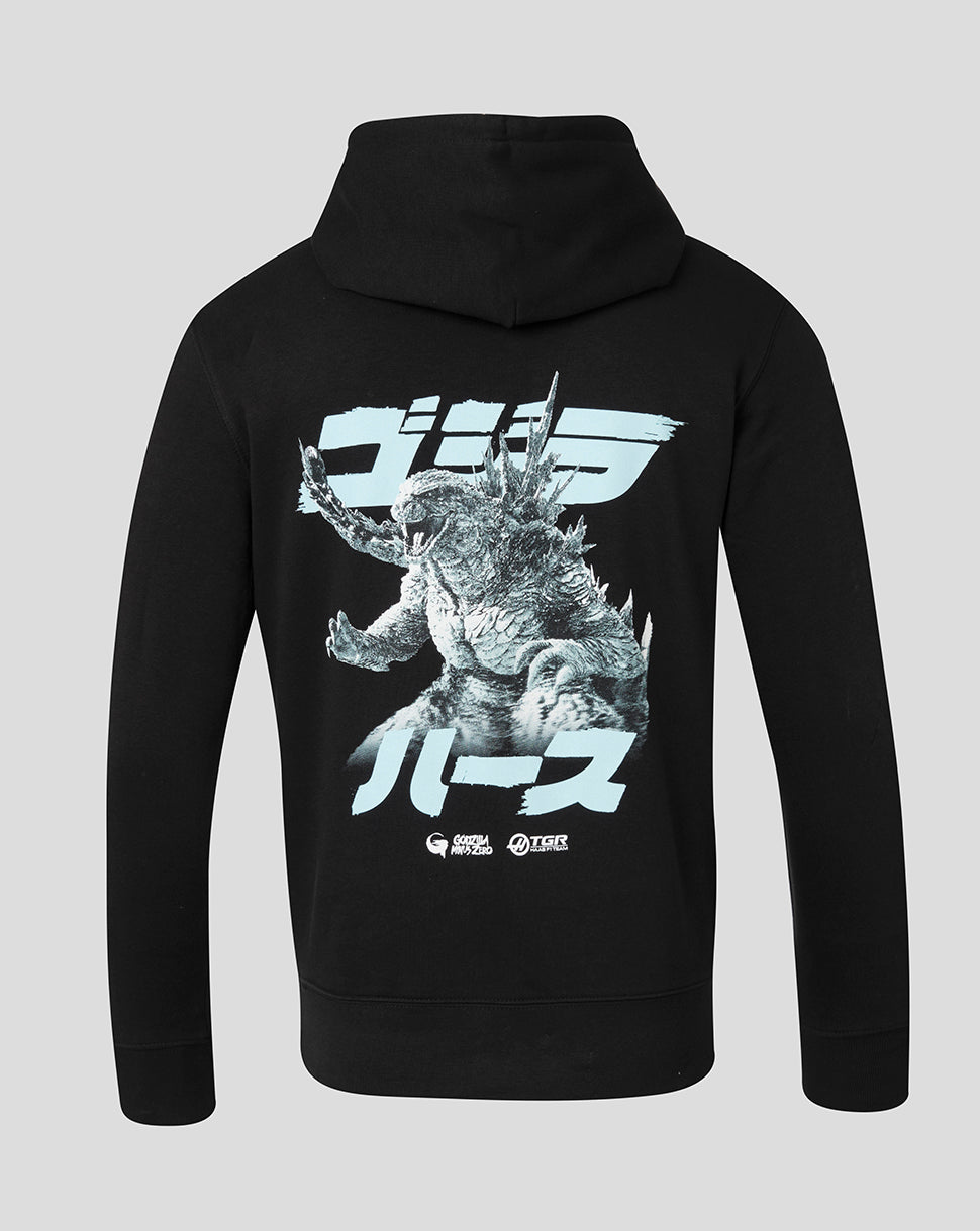 A black pullover hoodie shown from the back, featuring a large graphic print of Godzilla with Japanese text in white and light blue on a light gray background.