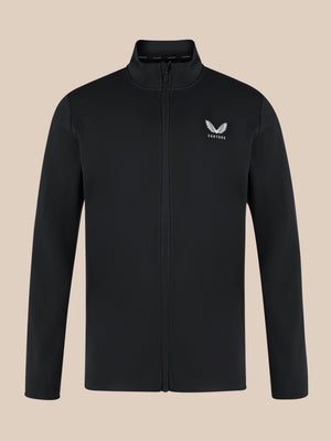Close up of black unisex softshell jacket with front zipper, high neck collar, and white Castore wing logo on the left chest