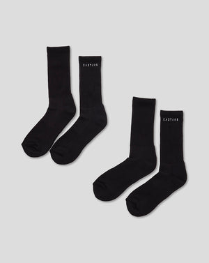 Two black Castore crew socks laid flat with ribbed cuffs for everyday wear.